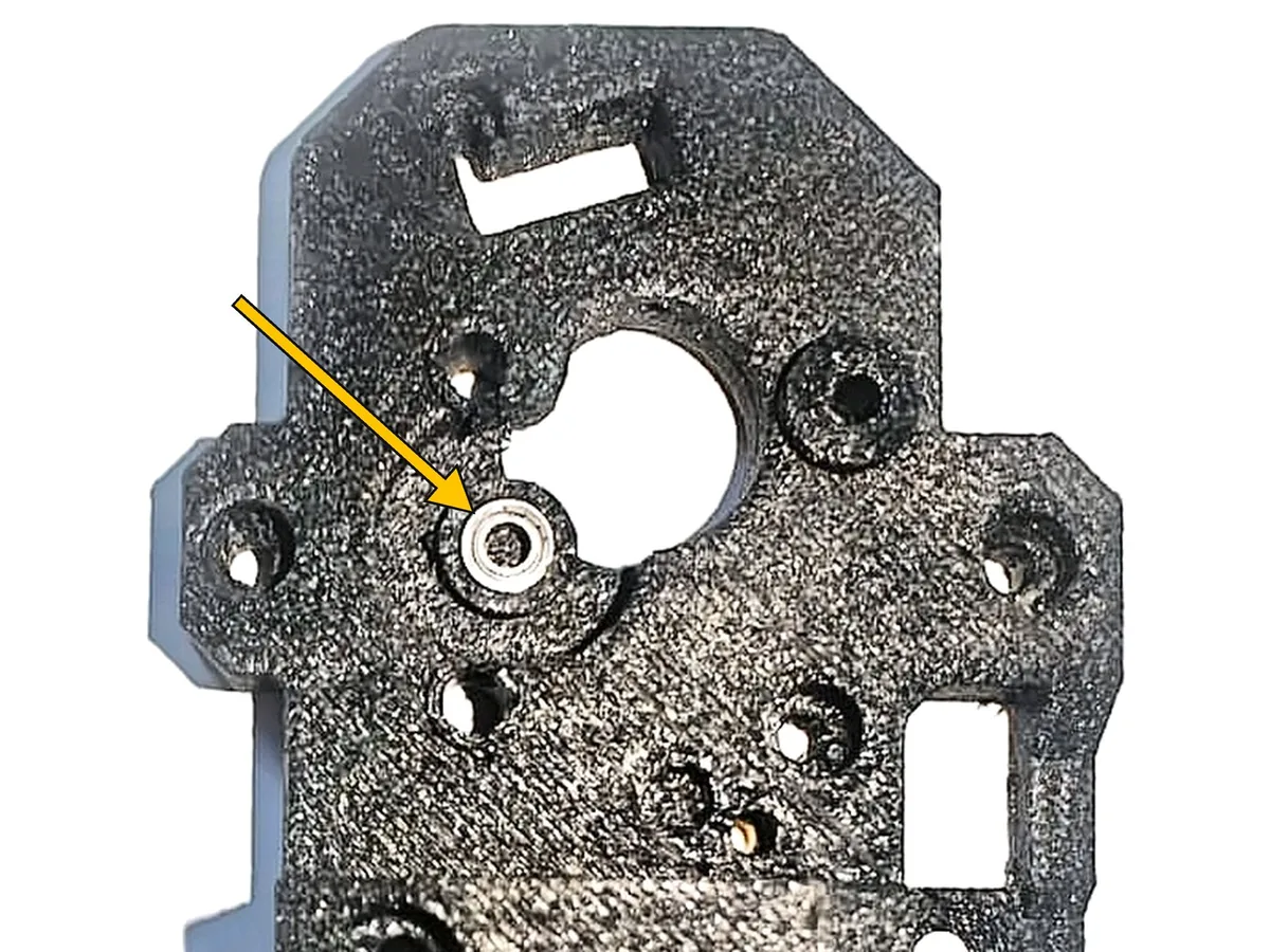 Step 2, inserting the bearing: Lay the main body (A) flat with the front side up. This is the side the gears go on.