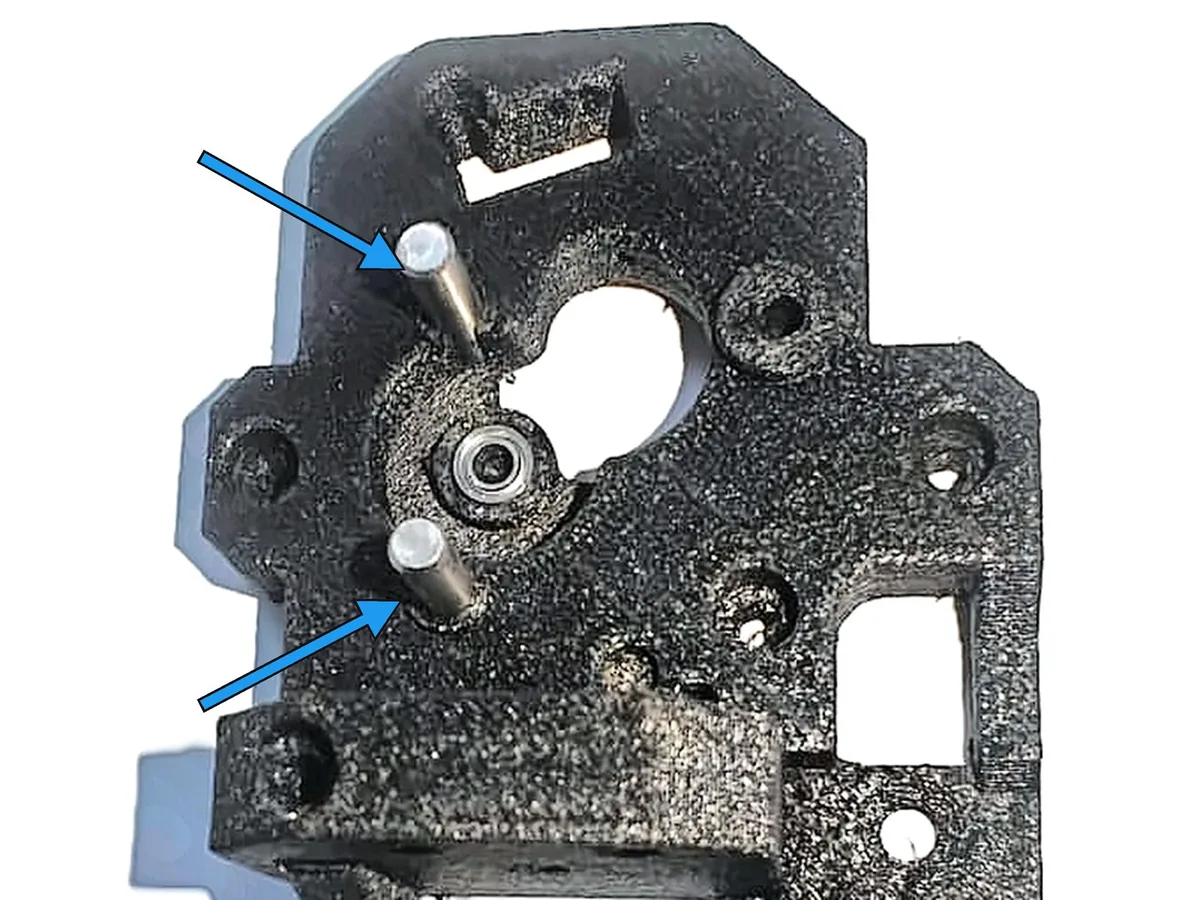 Step 3, inserting the dowel pins: Press the two M4 dowel pins (B) into the holes above and below the bearing.