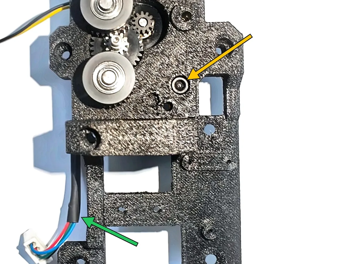 Step 12, mounting the motor: Place the motor (K) on the back of the main body, with its pinion through the large hole.