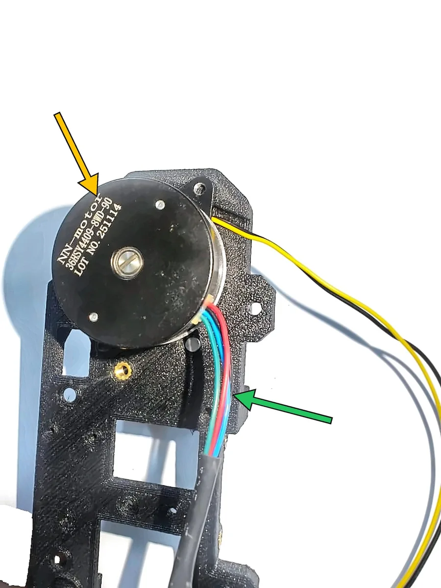 Step 13, routing the motor wire: Back view: the motor (K) sits on the back of the main body.