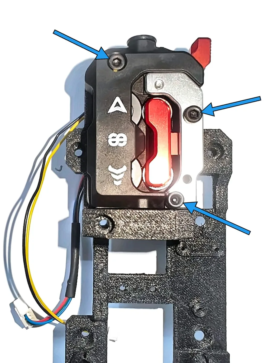 Step 15, mounting the extruder front body: Carefully place the front body (G) onto the main body. Keep it upright.