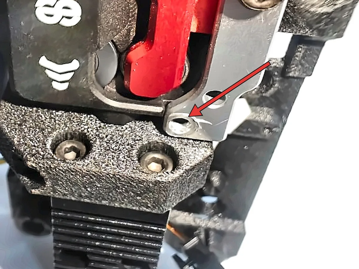 Step 17, removing one bolt: Temporarily remove the lower M3 bolt of the front body.