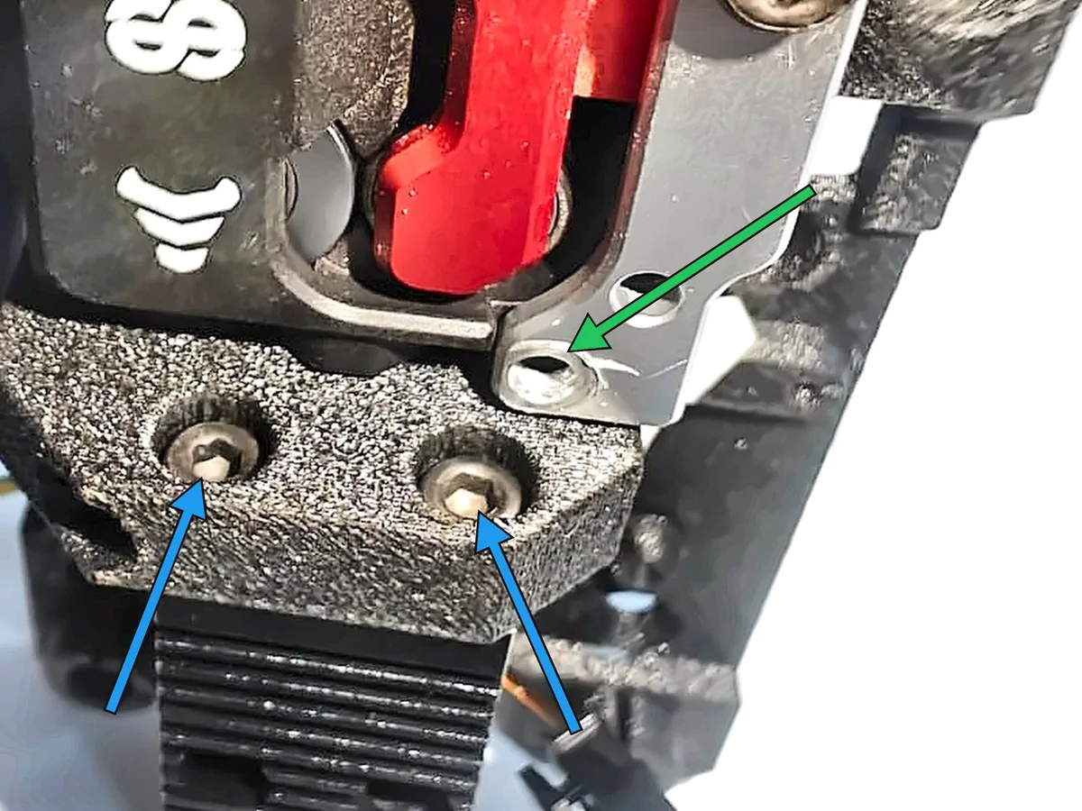Step 19, securing the hotend: Tighten the two M3 clamp bolts on top of the clamp block to secure the hotend.